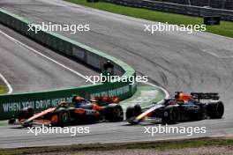 Lando Norris (GBR) McLaren MCL38 passes Max Verstappen (NLD) Red Bull Racing RB20 to take the lead of the race. 25.08.2024. Formula 1 World Championship, Rd 15, Dutch Grand Prix, Zandvoort, Netherlands, Race Day.