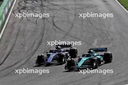 (L to R): Alexander Albon (THA) Williams Racing FW46 and Lance Stroll (CDN) Aston Martin F1 Team AMR24 battle for position. 25.08.2024. Formula 1 World Championship, Rd 15, Dutch Grand Prix, Zandvoort, Netherlands, Race Day.