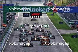 Max Verstappen (NLD) Red Bull Racing RB20 leads Lando Norris (GBR) McLaren MCL38 at the start of the race. 25.08.2024. Formula 1 World Championship, Rd 15, Dutch Grand Prix, Zandvoort, Netherlands, Race Day.