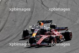 Sergio Perez (MEX) Red Bull Racing RB20 and Carlos Sainz Jr (ESP) Ferrari SF-24 battle for position. 25.08.2024. Formula 1 World Championship, Rd 15, Dutch Grand Prix, Zandvoort, Netherlands, Race Day.