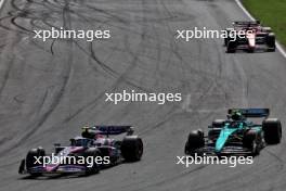 Pierre Gasly (FRA) Alpine F1 Team A524 and Fernando Alonso (ESP) Aston Martin F1 Team AMR24 battle for position. 25.08.2024. Formula 1 World Championship, Rd 15, Dutch Grand Prix, Zandvoort, Netherlands, Race Day.