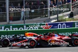 Sergio Perez (MEX) Red Bull Racing RB20 and Carlos Sainz Jr (ESP) Ferrari SF-24 battle for position. 25.08.2024. Formula 1 World Championship, Rd 15, Dutch Grand Prix, Zandvoort, Netherlands, Race Day.