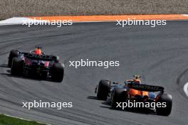 Max Verstappen (NLD) Red Bull Racing RB20 and Lando Norris (GBR) McLaren MCL38 battle for position. 25.08.2024. Formula 1 World Championship, Rd 15, Dutch Grand Prix, Zandvoort, Netherlands, Race Day.