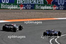 Nico Hulkenberg (GER) Haas VF-24 and Logan Sargeant (USA) Williams Racing FW46 battle for position. 25.08.2024. Formula 1 World Championship, Rd 15, Dutch Grand Prix, Zandvoort, Netherlands, Race Day.