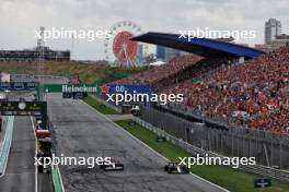 Yuki Tsunoda (JPN) RB VCARB 01 and Sergio Perez (MEX) Red Bull Racing RB20. 24.08.2024. Formula 1 World Championship, Rd 15, Dutch Grand Prix, Zandvoort, Netherlands, Qualifying Day.