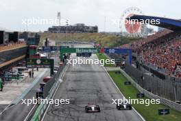 Kevin Magnussen (DEN) Haas VF-24 and George Russell (GBR) Mercedes AMG F1 W15. 24.08.2024. Formula 1 World Championship, Rd 15, Dutch Grand Prix, Zandvoort, Netherlands, Qualifying Day.