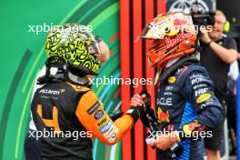 (L to R): Lando Norris (GBR) McLaren celebrates his pole position in qualifying parc ferme with second placed Max Verstappen (NLD) Red Bull Racing. 24.08.2024. Formula 1 World Championship, Rd 15, Dutch Grand Prix, Zandvoort, Netherlands, Qualifying Day.