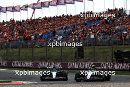 George Russell (GBR) Mercedes AMG F1 W15 and Lewis Hamilton (GBR) Mercedes AMG F1 W15. 24.08.2024. Formula 1 World Championship, Rd 15, Dutch Grand Prix, Zandvoort, Netherlands, Qualifying Day.