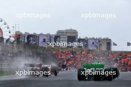 (L to R): Carlos Sainz Jr (ESP) Ferrari SF-24 and Zhou Guanyu (CHN) Sauber C44. 24.08.2024. Formula 1 World Championship, Rd 15, Dutch Grand Prix, Zandvoort, Netherlands, Qualifying Day.