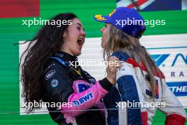 (L to R): Race winner Abbi Pulling (GBR) Rodin Motorsport celebrates on the podium with second placed Nerea Marti (ESP) Campos Racing. 25.08.2024. FIA Formula Academy, Rd 4, Race 1, Zandvoort, Netherlands, Sunday.