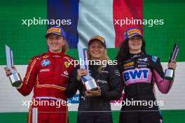 The podium (L to R): Maya Weug (NLD) Prema, second; Doriane Pin (FRA) Prema Racing, race winner; Abbi Pulling (GBR) Rodin Motorsport, third. 25.08.2024. FIA Formula Academy, Rd 4, Race 2, Zandvoort, Netherlands, Sunday.