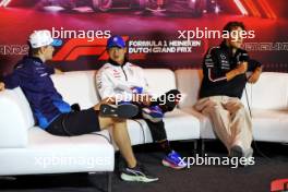 (L to R): Logan Sargeant (USA) Williams Racing; Yuki Tsunoda (JPN) RB; and George Russell (GBR) Mercedes AMG F1, in the FIA Press Conference. 22.08.2024. Formula 1 World Championship, Rd 15, Dutch Grand Prix, Zandvoort, Netherlands, Preparation Day.