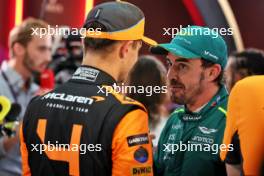 (L to R): Lando Norris (GBR) McLaren with Fernando Alonso (ESP) Aston Martin F1 Team. 08.03.2024. Formula 1 World Championship, Rd 2, Saudi Arabian Grand Prix, Jeddah, Saudi Arabia, Qualifying Day.