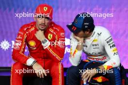 (L to R): Charles Leclerc (MON) Ferrari with Sergio Perez (MEX) Red Bull Racing in qualifying parc ferme. 08.03.2024. Formula 1 World Championship, Rd 2, Saudi Arabian Grand Prix, Jeddah, Saudi Arabia, Qualifying Day.
