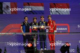 Jerome LaFarge,  Head of materials sciences, Red Bull Racing with 2nd place Sergio Perez (MEX) Red Bull Racing RB20, 1st place Max Verstappen (NLD) Red Bull Racing RB20 and 3rd place Charles Leclerc (MON) Ferrari F1-24. 09.03.2024. Formula 1 World Championship, Rd 2, Saudi Arabian Grand Prix, Jeddah, Saudi Arabia, Race Day.
