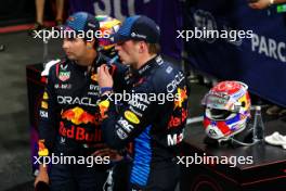 (L to R): second placed Sergio Perez (MEX) Red Bull Racing with team mate and race winner Max Verstappen (NLD) Red Bull Racing in parc ferme. 09.03.2024. Formula 1 World Championship, Rd 2, Saudi Arabian Grand Prix, Jeddah, Saudi Arabia, Race Day.