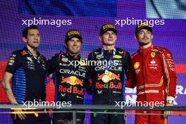 Jerome LaFarge,  Head of materials sciences, Red Bull Racing with 2nd place Sergio Perez (MEX) Red Bull Racing RB20, 1st place Max Verstappen (NLD) Red Bull Racing RB20 and 3rd place Charles Leclerc (MON) Ferrari F1-24. 09.03.2024. Formula 1 World Championship, Rd 2, Saudi Arabian Grand Prix, Jeddah, Saudi Arabia, Race Day.