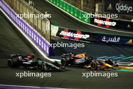 Lewis Hamilton (GBR) Mercedes AMG F1 W15 and Sergio Perez (MEX) Red Bull Racing RB20 battle for position. 09.03.2024. Formula 1 World Championship, Rd 2, Saudi Arabian Grand Prix, Jeddah, Saudi Arabia, Race Day.