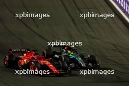 Charles Leclerc (MON) Ferrari SF-24 and Lewis Hamilton (GBR) Mercedes AMG F1 W15 battle for position. 09.03.2024. Formula 1 World Championship, Rd 2, Saudi Arabian Grand Prix, Jeddah, Saudi Arabia, Race Day.