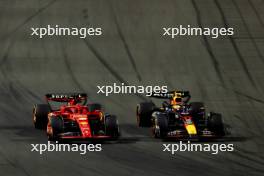 (L to R): Charles Leclerc (MON) Ferrari SF-24 and Sergio Perez (MEX) Red Bull Racing RB20 battle for position. 09.03.2024. Formula 1 World Championship, Rd 2, Saudi Arabian Grand Prix, Jeddah, Saudi Arabia, Race Day.