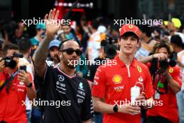 (L to R): Lewis Hamilton (GBR) Mercedes AMG F1 and Oliver Bearman (GBR) Ferrari Reserve Driver on the drivers' parade. 09.03.2024. Formula 1 World Championship, Rd 2, Saudi Arabian Grand Prix, Jeddah, Saudi Arabia, Race Day.