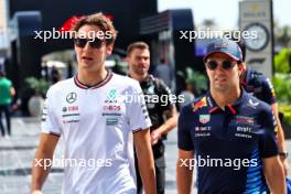 (L to R): George Russell (GBR) Mercedes AMG F1 with Sergio Perez (MEX) Red Bull Racing. 07.03.2024. Formula 1 World Championship, Rd 2, Saudi Arabian Grand Prix, Jeddah, Saudi Arabia, Practice Day.