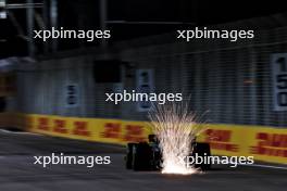 Fernando Alonso (ESP) Aston Martin F1 Team AMR24 sends sparks flying. 20.09.2024. Formula 1 World Championship, Rd 18, Singapore Grand Prix, Marina Bay Street Circuit, Singapore, Practice Day.