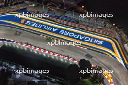 Nico Hulkenberg (GER) Haas VF-24 leads Valtteri Bottas (FIN) Sauber C44 and Pierre Gasly (FRA) Alpine F1 Team A524. 20.09.2024. Formula 1 World Championship, Rd 18, Singapore Grand Prix, Marina Bay Street Circuit, Singapore, Practice Day.