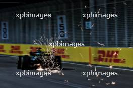 Lance Stroll (CDN) Aston Martin F1 Team AMR24 sends sparks flying. 20.09.2024. Formula 1 World Championship, Rd 18, Singapore Grand Prix, Marina Bay Street Circuit, Singapore, Practice Day.