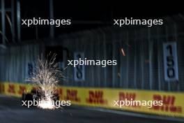 Lance Stroll (CDN) Aston Martin F1 Team AMR24 sends sparks flying. 20.09.2024. Formula 1 World Championship, Rd 18, Singapore Grand Prix, Marina Bay Street Circuit, Singapore, Practice Day.