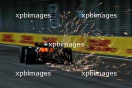 Lando Norris (GBR) McLaren MCL38 sends sparks flying. 20.09.2024. Formula 1 World Championship, Rd 18, Singapore Grand Prix, Marina Bay Street Circuit, Singapore, Practice Day.