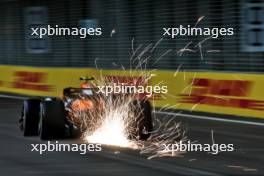 Lando Norris (GBR) McLaren MCL38 sends sparks flying. 20.09.2024. Formula 1 World Championship, Rd 18, Singapore Grand Prix, Marina Bay Street Circuit, Singapore, Practice Day.