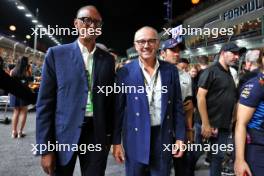 (L to R): Paul Kagame (RWA) President of Rwanda on the grid with Stefano Domenicali (ITA) Formula One President and CEO. 22.09.2024. Formula 1 World Championship, Rd 18, Singapore Grand Prix, Marina Bay Street Circuit, Singapore, Race Day.