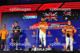 The podium (L to R): Max Verstappen (NLD) Red Bull Racing, second; Lando Norris (GBR) McLaren, race winner; Oscar Piastri (AUS) McLaren, third. 22.09.2024. Formula 1 World Championship, Rd 18, Singapore Grand Prix, Marina Bay Street Circuit, Singapore, Race Day.