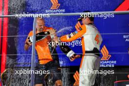 Race winner Lando Norris (GBR) McLaren celebrates on the podium with Paul Barnes (GBR) McLaren Director of Support and Logistics. 22.09.2024. Formula 1 World Championship, Rd 18, Singapore Grand Prix, Marina Bay Street Circuit, Singapore, Race Day.