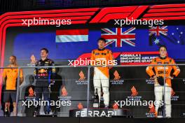 The podium (L to R): Max Verstappen (NLD) Red Bull Racing, second; Lando Norris (GBR) McLaren, race winner; Oscar Piastri (AUS) McLaren, third. 22.09.2024. Formula 1 World Championship, Rd 18, Singapore Grand Prix, Marina Bay Street Circuit, Singapore, Race Day.