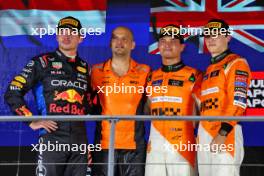 The podium (L to R): Max Verstappen (NLD) Red Bull Racing, second; Paul Barnes (GBR) McLaren Director of Support and Logistics celebrates on the podium; Lando Norris (GBR) McLaren, race winner; Oscar Piastri (AUS) McLaren, third. 22.09.2024. Formula 1 World Championship, Rd 18, Singapore Grand Prix, Marina Bay Street Circuit, Singapore, Race Day.