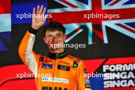 Race winner Lando Norris (GBR) McLaren celebrates on the podium. 22.09.2024. Formula 1 World Championship, Rd 18, Singapore Grand Prix, Marina Bay Street Circuit, Singapore, Race Day.