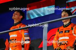 The podium (L to R): Race winner Lando Norris (GBR) McLaren on the podium with third placed team mate Oscar Piastri (AUS) McLaren. 22.09.2024. Formula 1 World Championship, Rd 18, Singapore Grand Prix, Marina Bay Street Circuit, Singapore, Race Day.