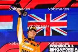 Race winner Lando Norris (GBR) McLaren celebrates on the podium. 22.09.2024. Formula 1 World Championship, Rd 18, Singapore Grand Prix, Marina Bay Street Circuit, Singapore, Race Day.