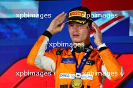 Race winner Lando Norris (GBR) McLaren celebrates on the podium. 22.09.2024. Formula 1 World Championship, Rd 18, Singapore Grand Prix, Marina Bay Street Circuit, Singapore, Race Day.