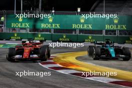 Charles Leclerc (MON) Ferrari SF-24 and George Russell (GBR) Mercedes AMG F1 W15 battle for position. 22.09.2024. Formula 1 World Championship, Rd 18, Singapore Grand Prix, Marina Bay Street Circuit, Singapore, Race Day.