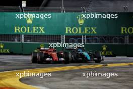 Charles Leclerc (MON) Ferrari SF-24 and George Russell (GBR) Mercedes AMG F1 W15 battle for position. 22.09.2024. Formula 1 World Championship, Rd 18, Singapore Grand Prix, Marina Bay Street Circuit, Singapore, Race Day.