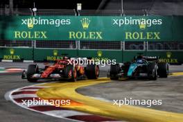 Charles Leclerc (MON) Ferrari SF-24 and George Russell (GBR) Mercedes AMG F1 W15 battle for position. 22.09.2024. Formula 1 World Championship, Rd 18, Singapore Grand Prix, Marina Bay Street Circuit, Singapore, Race Day.