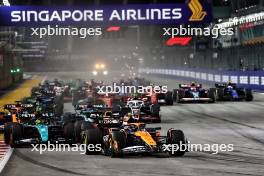 Lando Norris (GBR) McLaren MCL38 leads at the start of the race. 22.09.2024. Formula 1 World Championship, Rd 18, Singapore Grand Prix, Marina Bay Street Circuit, Singapore, Race Day.