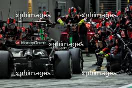 Kevin Magnussen (DEN) Haas VF-24 makes a pit stop. 22.09.2024. Formula 1 World Championship, Rd 18, Singapore Grand Prix, Marina Bay Street Circuit, Singapore, Race Day.