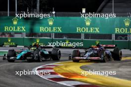 Lewis Hamilton (GBR) Mercedes AMG F1 W15 and Yuki Tsunoda (JPN) RB VCARB 01 battle for position. 22.09.2024. Formula 1 World Championship, Rd 18, Singapore Grand Prix, Marina Bay Street Circuit, Singapore, Race Day.