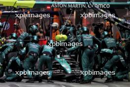 Lance Stroll (CDN) Aston Martin F1 Team AMR24 makes a pit stop. 22.09.2024. Formula 1 World Championship, Rd 18, Singapore Grand Prix, Marina Bay Street Circuit, Singapore, Race Day.