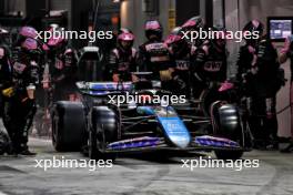 Esteban Ocon (FRA) Alpine F1 Team A524 makes a pit stop. 22.09.2024. Formula 1 World Championship, Rd 18, Singapore Grand Prix, Marina Bay Street Circuit, Singapore, Race Day.