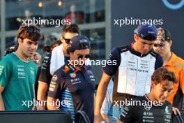 Sergio Perez (MEX) Red Bull Racing and Alexander Albon (THA) Williams Racing on the drivers' parade. 22.09.2024. Formula 1 World Championship, Rd 18, Singapore Grand Prix, Marina Bay Street Circuit, Singapore, Race Day.